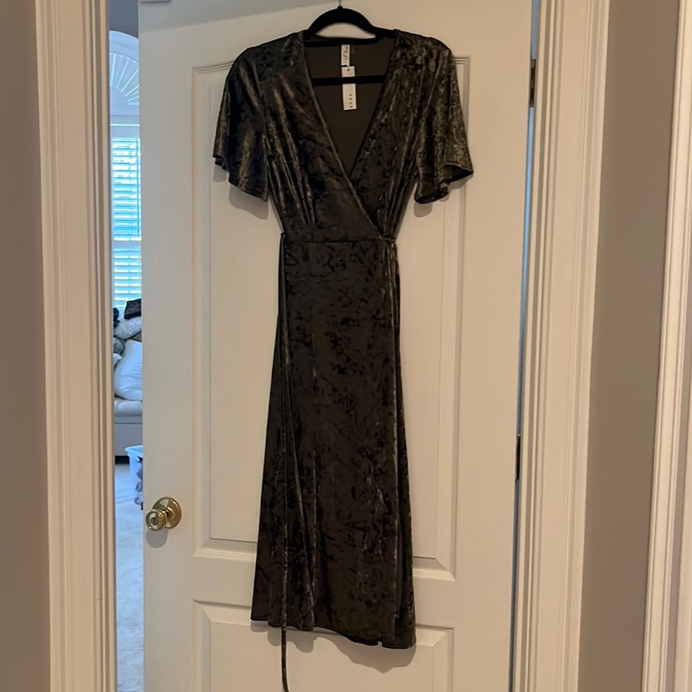 Olive green velvet wrap dress sold by Baltic Born